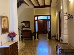 a hallway of a house with aoyer with a door at Casa Rural Frigols in Chella