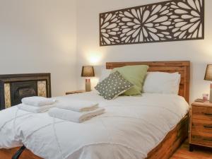 Black Spout Cottage tesisinde bir odada yatak veya yataklar