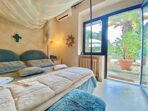 Postel nebo postele na pokoji v ubytování Le due palme Bed & Breakfast