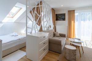 Posteľ alebo postele v izbe v ubytovaní Apartamenty Defala i Strefa Relaksu Natural Touch