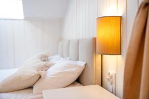 Posteľ alebo postele v izbe v ubytovaní Apartamenty Defala i Strefa Relaksu Natural Touch