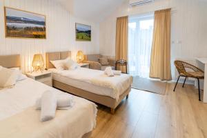 Posteľ alebo postele v izbe v ubytovaní Apartamenty Defala i Strefa Relaksu Natural Touch