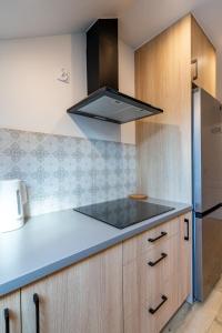 Kuchyňa alebo kuchynka v ubytovaní Apartamenty Defala i Strefa Relaksu Natural Touch