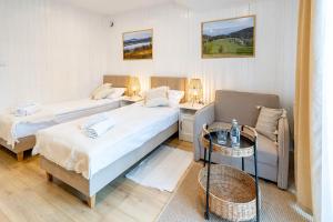 Posteľ alebo postele v izbe v ubytovaní Apartamenty Defala i Strefa Relaksu Natural Touch