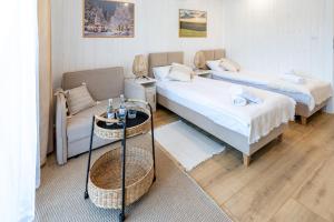 Posteľ alebo postele v izbe v ubytovaní Apartamenty Defala i Strefa Relaksu Natural Touch