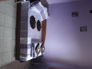 a bunch of towels are hanging in a bathroom at Hostel Victoria in Silistra