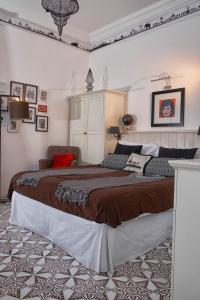 a bedroom with a large bed and a large mirror at Affittacamere Capri Dolce Vita in Capri