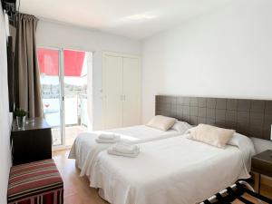 Postel nebo postele na pokoji v ubytování Grupoandria Hotel Platja Gran