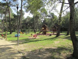 a park with a playground with a play equipment at CASA MIRO' vicinissima al mare e parcheggio privato gratuito se disponibile in Pescara
