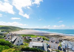 an aerial view of a beach with houses and the ocean at The Albatross 12 in Woolacombe