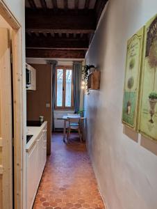 a kitchen with a hallway leading to a dining room at Renovated fully equipped studio for 2 to 4 pers in La Ciotat