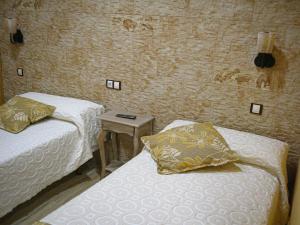 Postel nebo postele na pokoji v ubytování Hotel Un lugar en la Vecilla