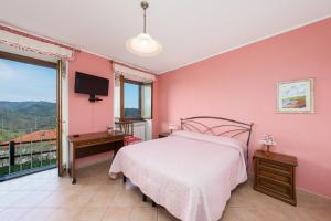 Postel nebo postele na pokoji v ubytování Agriturismo Daniela