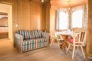 a living room with a couch and a table at Haus Barbarahof in Altenmarkt im Pongau