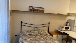 Postel nebo postele na pokoji v ubytování Caravaggio Apartments