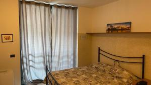 Postel nebo postele na pokoji v ubytování Caravaggio Apartments