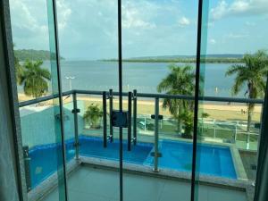 a view from the balcony of a hotel with a view of the beach at Hotel Vale Do Xingu in Altamira