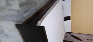 a staircase with a television in a room at OYO Hotel Krishna Garden in Nawāda