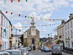 a street in a small town with a clock tower at The Old Pharmacy in Narberth