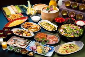 a table topped with lots of different types of food at Hotel Wing International Kyoto - Shijo Karasuma in Kyoto