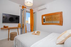 Ένα ή περισσότερα κρεβάτια σε δωμάτιο στο Colors of Mykonos, Ano Mera Apartment +28 φωτογραφίες