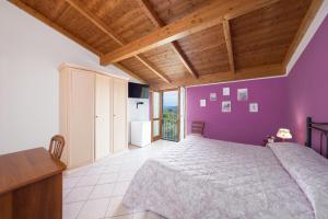 Postel nebo postele na pokoji v ubytování Agriturismo Daniela