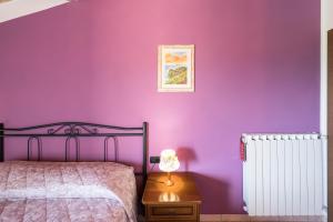 Postel nebo postele na pokoji v ubytování Agriturismo Daniela
