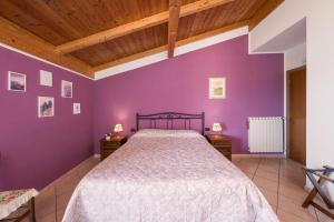 Postel nebo postele na pokoji v ubytování Agriturismo Daniela