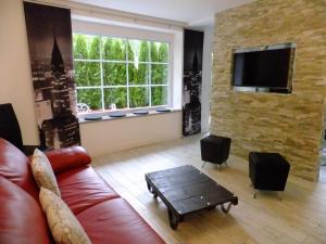 TV a/nebo společenská místnost v ubytování LakeStarnberg Apartments