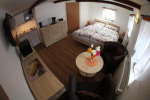 an aerial view of a bedroom with a bed and a table at Ferienhaus Montana in Bad Schandau +26 photos