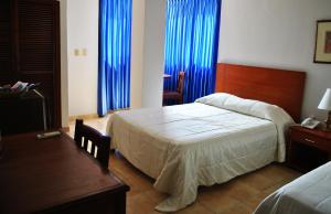 Voodi või voodid majutusasutuse Hotel Majayura Sol toas