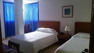 Voodi või voodid majutusasutuse Hotel Majayura Sol toas