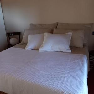 מיטה או מיטות בחדר ב-Alice nel Paese delle Meraviglie