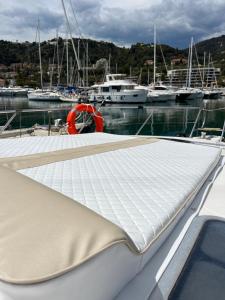 a boat with a mattress on the deck at MareLuna in Menton