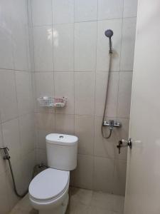 a bathroom with a toilet and a shower stall at SAMARA VILLA in Batu +21 photos