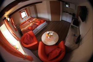 an overhead view of a bedroom with a table and chairs at Ferienhaus Montana in Bad Schandau