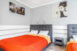 Postel nebo postele na pokoji v ubytování Aqua Viva Darłowo Apartment by Noclegi Renters