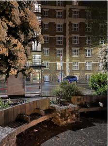 a building with a car parked in front of it at Tower Bridge! Immaculate One Bed in London