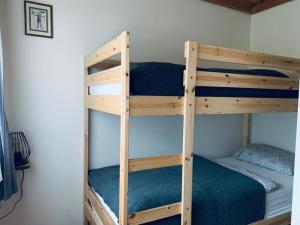 A bed or beds in a room at Lilly Chalet- Apartments with private sauna, close to ski lifts
