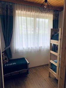 A bed or beds in a room at Lilly Chalet- Apartments with private sauna, close to ski lifts