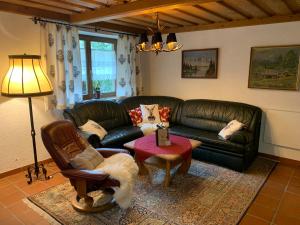 A seating area at Lilly Chalet- Apartments with private sauna, close to ski lifts
