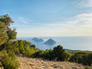 a view of the ocean with islands in the distance at Gelidonya Pansiyon in Kumluca +110 photos