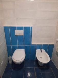 a bathroom with a toilet and a sink at Poseidone in Lipari +14 photos