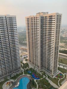 an aerial view of tall buildings in a city at Lu Luxury Homestay et Apartment - Vinhomes Smart City Hanoi in Hanoi