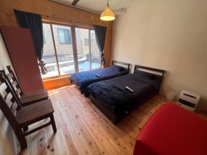 Postel nebo postele na pokoji v ubytování NAAARU