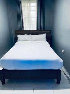 Posteľ alebo postele v izbe v ubytovaní Dad's Place