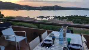 a table with a view of a body of water at Marinella Sky View in Marinella