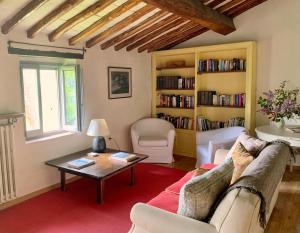 a living room with a couch and a coffee table at Antico Borgo di Sugame in Greve in Chianti