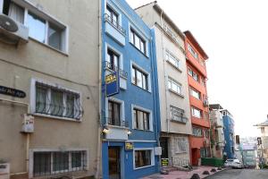 a blue building on the side of a street at Pera Sultan Suit in Istanbul
