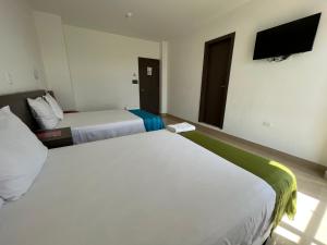 En eller flere senger på et rom på Mare S&M Casa Hostal